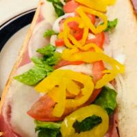 Italian Combo Grinder · Ham, salami, provolone cheese, lettuce, tomatoes, onions, hot peppers, oil, and vinegar.
