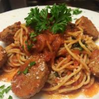 Spaghetti with Meatballs · Spaghetti topped in our homemade meatballs.
