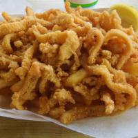 Fried Clams · Fried clam with french fries.