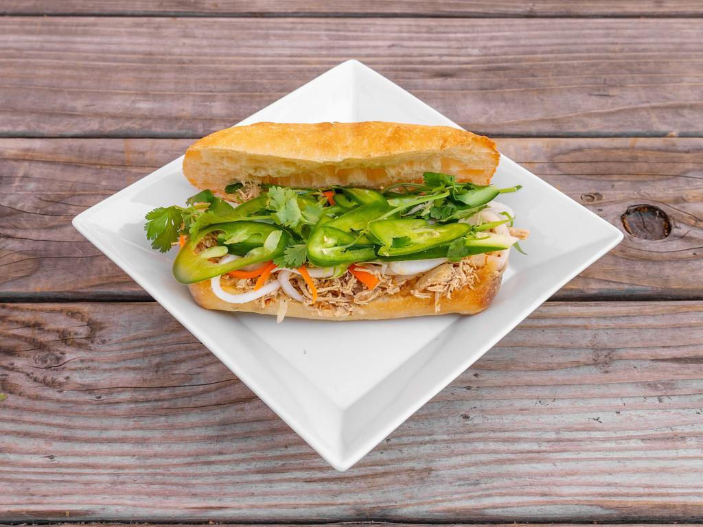 Z7M. Chicken Banh Mi · Shredded roasted chicken, demi baguette, pickled carrots and daikon, cilantro, scallions, cucumbers, jalapeno and garlic aioli.