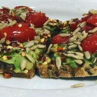 Sweet and Spicy Avocado Toast · Smashed avocado, grape tomatoes, crushed red pepper, honey, sunflower seeds and toasted mult...