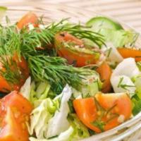 Green Salad · Organic Spring Mix-(A Blend of Tender Baby Greens), parsley, tomatoes, cucumbers, and served...