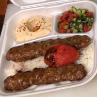 Beef Lula Kabob Plate ·  Two skewers of ground beef marinated with our mix of spices served over rice, with salad, h...