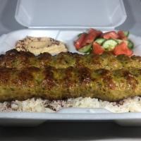 Chicken Lula Kabob Plate · Two skewers of ground chicken marinated with our mix of spices served over rice, with salad,...