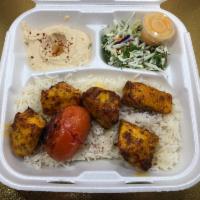 Chicken Shish Plate · Chicken breast pieces marinated with our mix of spices served over rice with salad, hummus, ...