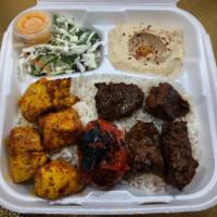 Beef and Chicken Shish  Plate · 4 pieces of filet mignon and chicken shish served on a bed of rice, sides of salad, hummus, ...