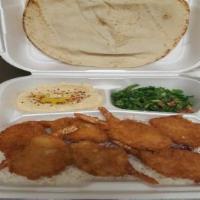 Shrimp Plate · Fried shrimp served over a bed of rice, sides of salad, hummus, pita bread, and cocktail sau...