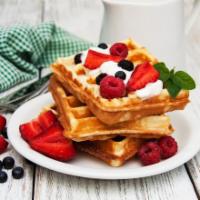 Waffles with Fruit · Belgian-style waffles topped with mixed fruits.