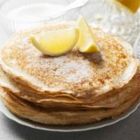 Pancakes with Sugar · Fluffy butter-milk pancakes topped with sugar.