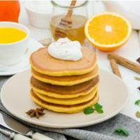 Pancakes with Whipped Cream · Fluffy butter-milk pancakes topped with whip cream.