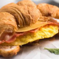 Sausage, Egg & Cheese on Croissant · Customer's choice of eggs, melted cheese and cooked sausage inside warm and buttery croissant.