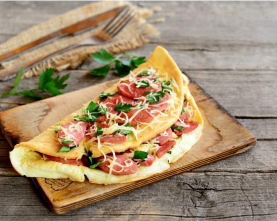 Western Omelette · Western-style omelette with slices of ham, mixed peppers and diced onions.
