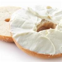 Bagel with Veggie Cream Cheese · Fresh baked bagel with veggie cream cheese inside.