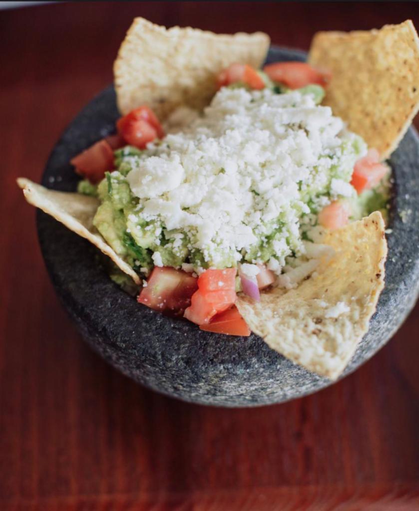 Fresh Made Guacamole · Served with diced tomatoes, onions, cilantro, lime juice.