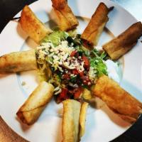 Flautas · 4 pieces. Chicken or beef, rolled dip fried on flour tortilla with salad.
