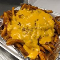Awesome Fries · Seasoned Fries covered with melted cheese and bacon. With ranch dressing on the side.
