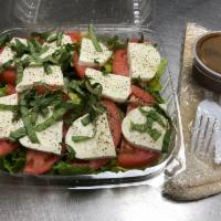 Caprese Salad · Romaine lettuce, fresh mozzarella, tomatoes, fresh basil, salt and black peppers. Served wit...