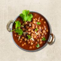 Chickpea Charm (Vegan) · Slow-cooked chickpeas with spices mixed with onion and tomatoes