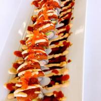 Hurricane Roll · In: Crab and avocado. Out: Spicy tuna, spicy sauce, house sauce and tobiko. Raw and spicy.