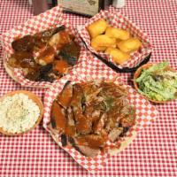 Family Package #1 · 1 lb. of beef brisket or pulled pork, one hot link with choice of two pint sides and 3 garli...