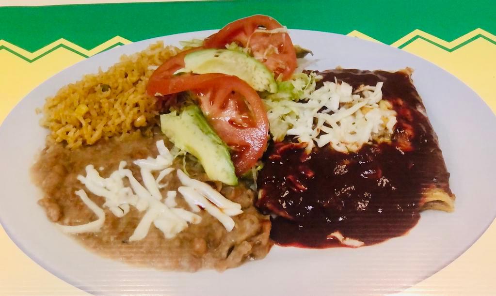 Enchiladas Rojas o Verdes · 3 corn tortillas stuffed with ground beef, chicken or skirt steak. Topped with red or green sauce.