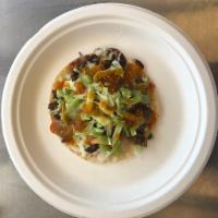 Vampiro · Corn tostada with cheese, cilantro, onion, shredded cabbage and choice of meat. Pastor or ca...