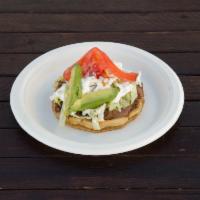 Sope · Thick corn based tortilla, beans, lettuce, tomatoes, avocado, queso fresco and sour cream wi...