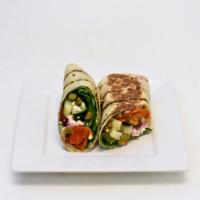 Spicy Griego Wrap · Cucumbers, spinach, beets, spicy asparagus, roasted tomato, hummus and feta. Vegetarian.