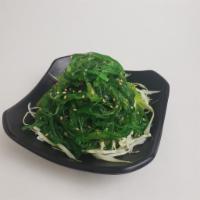 Seaweed Salad · Seasoned seaweed salad with ponzu sprinkled with sesame seeds.