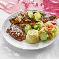 Tilapia Frita · Fried tilapia served with rice, beans and salad.