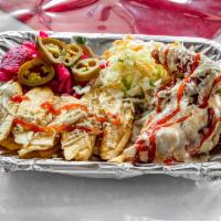 Pollo con Tajadas Plate · Served with prepared cabbage and pickled onions, cheese, sauce, ketchup and mayo.