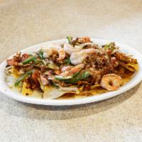 Nachos Fajita · Fajita-style beef or chicken with grilled onions, bell peppers and tomatoes.