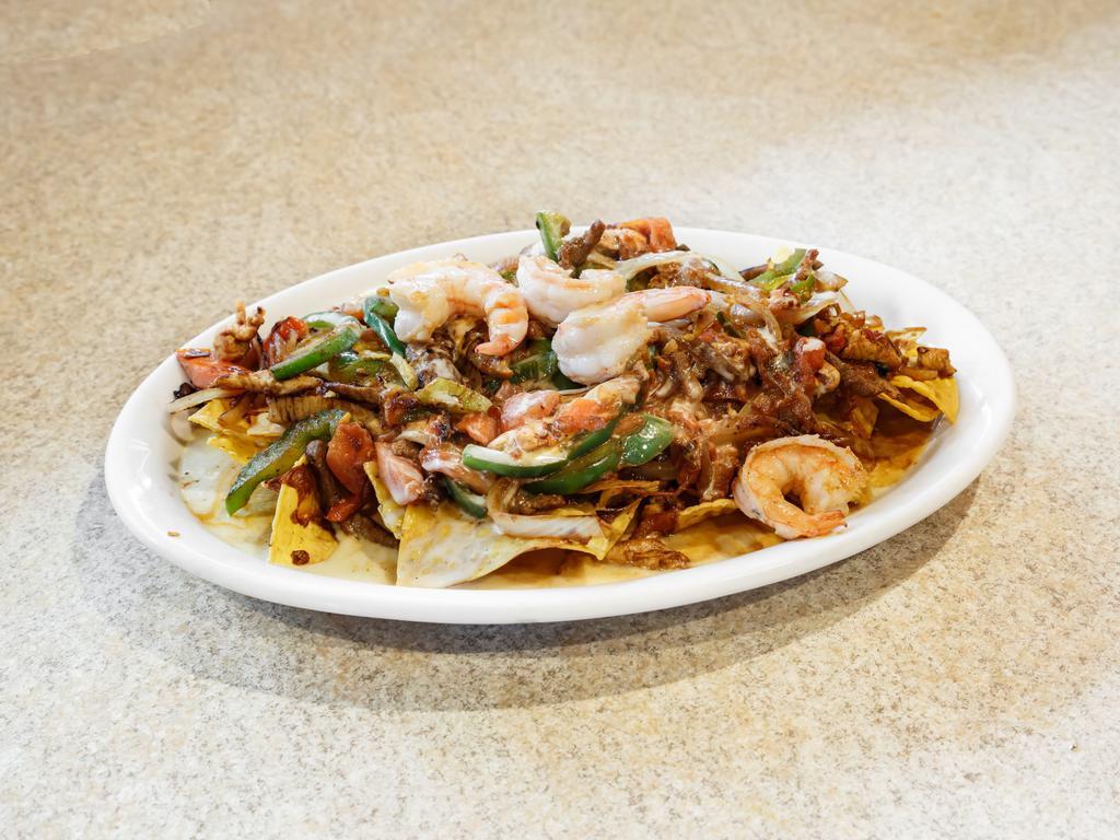Nachos Fajita · Fajita-style beef or chicken with grilled onions, bell peppers and tomatoes.