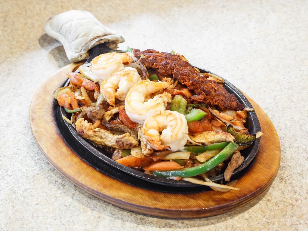 Fajitas Jalisco · A sizzling platter of tender marinated beef chicken, shrimp and chorizo grilled using our special recipe.