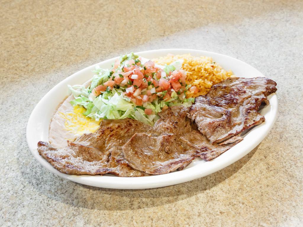 Carne Asada · Thin cut of grilled steak. Served with Mexican rice, re-fried beans, lettuce, guacamole and sour cream.