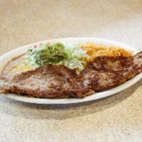 Mexican Milanesa · Thin cut of steak seasoned with our special recipe and breaded, then fried to golden brown. ...