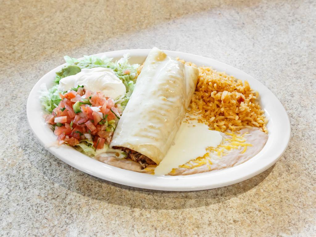 Chimichanga · We stuff a flour tortilla with your choice of chunks of beef or spicy chicken, then deep fry it to a golden brown. Topped with cheese sauce, lettuce, guacamole, pico de gallo and sour cream. Served with Mexican rice and re-fried beans.