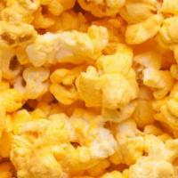 Cheesy Cheddar Popcorn · Fresh Popped butterfly corn enrobed in our Doc Popcorn Cheesy Cheddar blend.  A Cheesy treat...