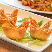 Crab Puffs 蟹         角 · 8 pieces. deep fried wonton with cream cheese and imitation crab meat