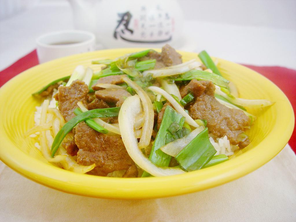 Mongolian Beef · Beef sliced tossed with yellow, and green onions in our house specialty soy cooking sauce. 