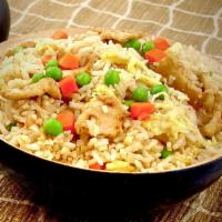 Chicken Fried Rice · Rice wok tossed with eggs, peas and carrot with our house soy sauce.