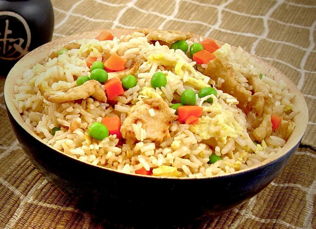 Chicken Fried Rice · Rice wok tossed with eggs, peas and carrot with our house soy sauce.