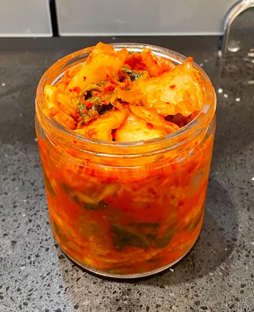 Original Kimchi/Napa Cabbage Kimchi (Baechu Kimchi - 배추김치) · The most recognizable and popular variety of the beloved Korean dish, Kimchi, utilizing Napa Cabbage. Kimchi, in general, is aged vegetable set to slowly ferment in a Korean Red Pepper Paste that is unique to the person who makes it. It's a dish that only tastes better the more it ages! Sold in a 16oz glass container, so you can keep it properly sealed.