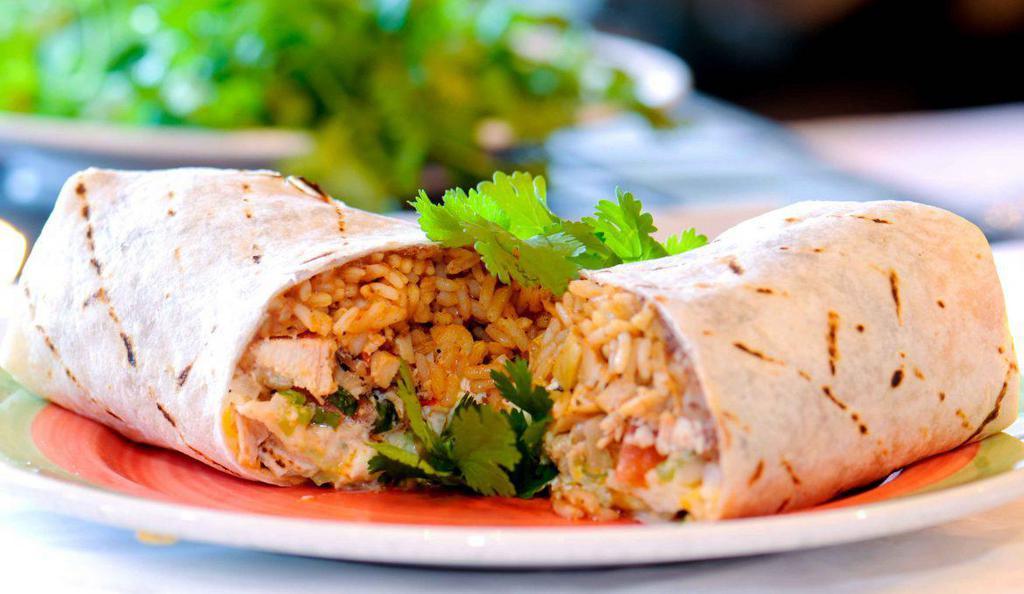 B1. Chicken Burrito · Served w.12 inch fresh flour tortillas with rice ,bean ,lettuce ,cheese and tomato