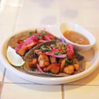 2 Adobado Tacos · Guajillo adobo chicken served on 3 sisters blue corn tortilla with pickled red onion, cilant...