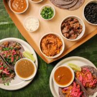 Tropicale Taco Kit · Six handmade corn tortillas, pickled red onions, cilantro, black beans, up to 2 choices of s...