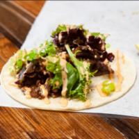 Side Taco · Choice of protein, Korean salad mix, green onion, seoul sauce, crushed sesame seeds, and a w...