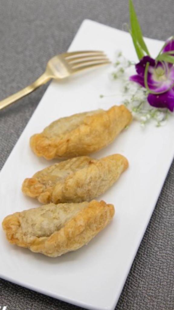 13. Curry Puff · 3 pieces. Stuffed with chicken, potato, onion and curry powder with cucumber sauce.
