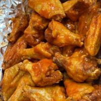 Wings · Cooked wing of a chicken coated in sauce or seasoning. 