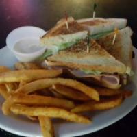 TURF GRILLED CLUB SANDWHICH  · Turkey, ham, crispy bacon, lettuce, tomato, and mayo served on your choice of bread. Upgrade...